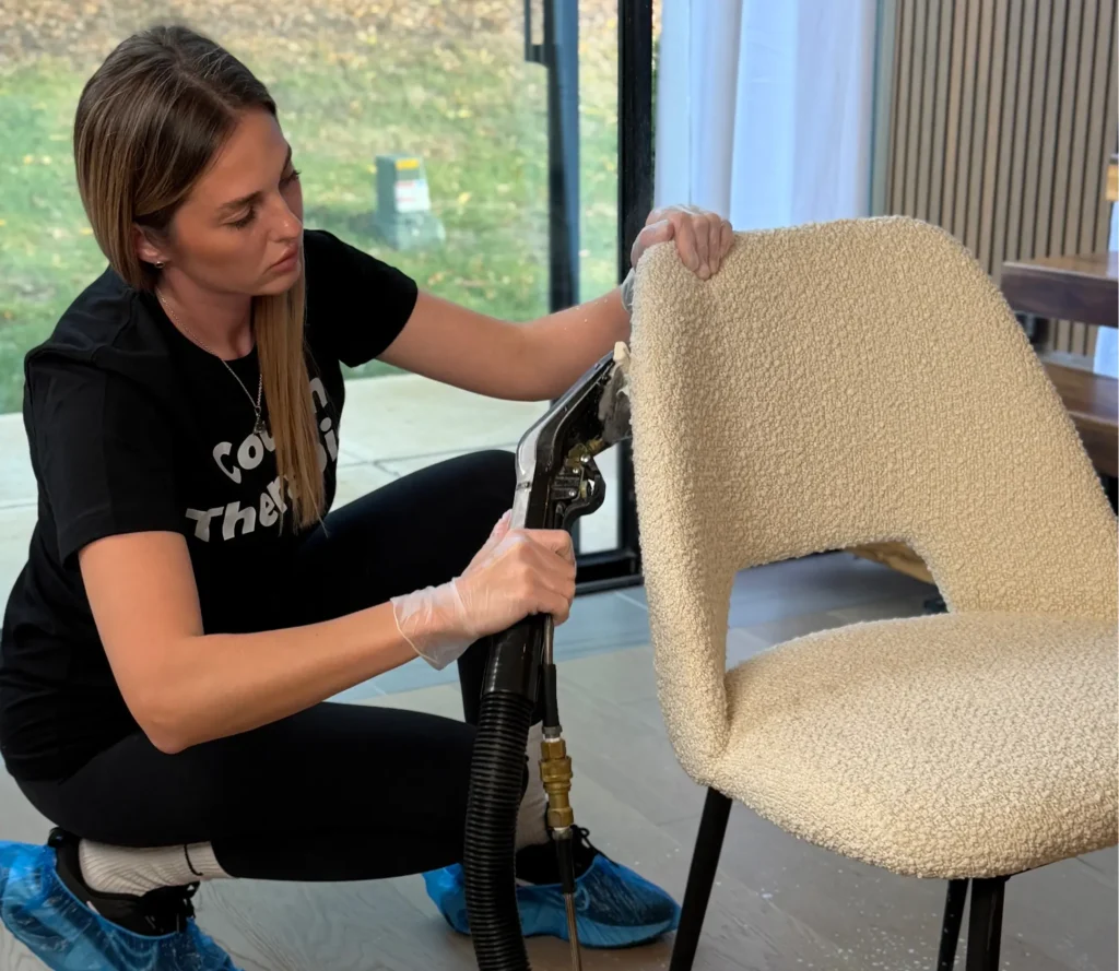 Chair upholstery cleaning with professional equipment to remove stains and fabric buildup