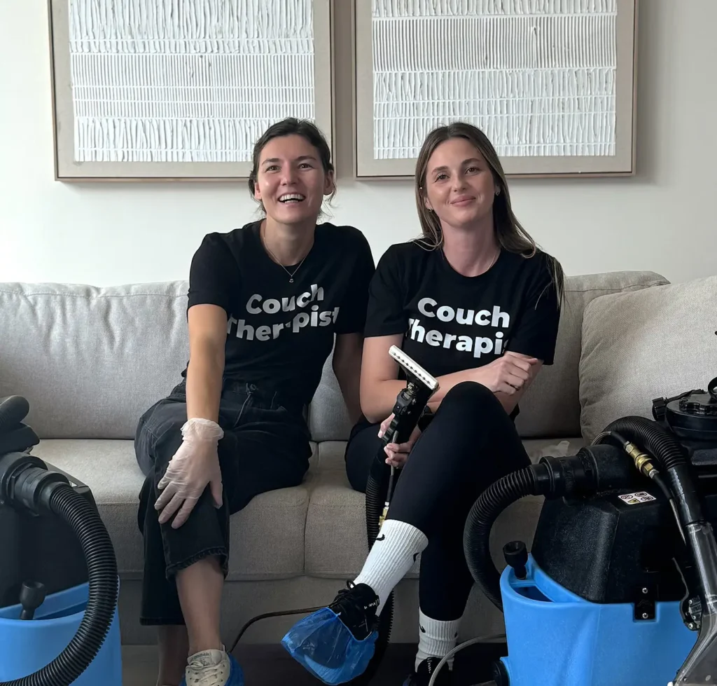 Upholstery cleaning team performing a step-by-step couch cleaning process in a Charlotte home