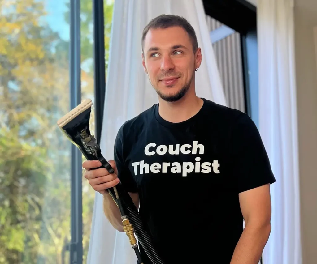 Founder of Texas Steamers – Couch Cleaning in Dallas holding upholstery steamer wand for professional couch and upholstery cleaning, stain removal, and pet stains removal